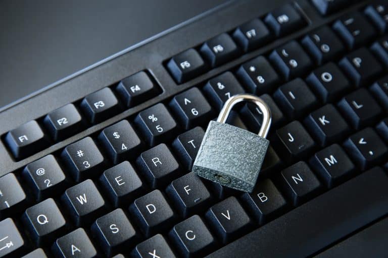 A padlock on top of a computer keyboard